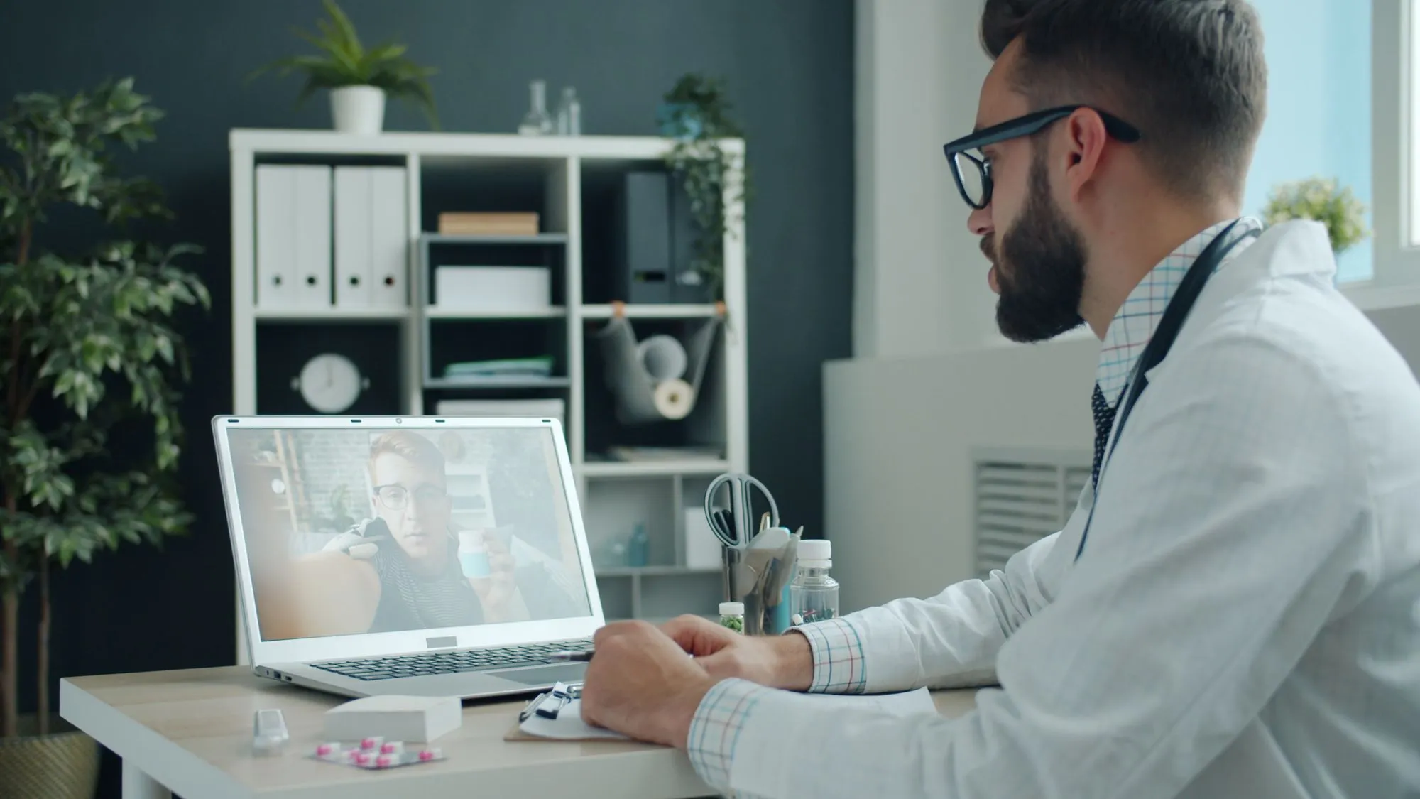 Doctor talking with a patient over a video call